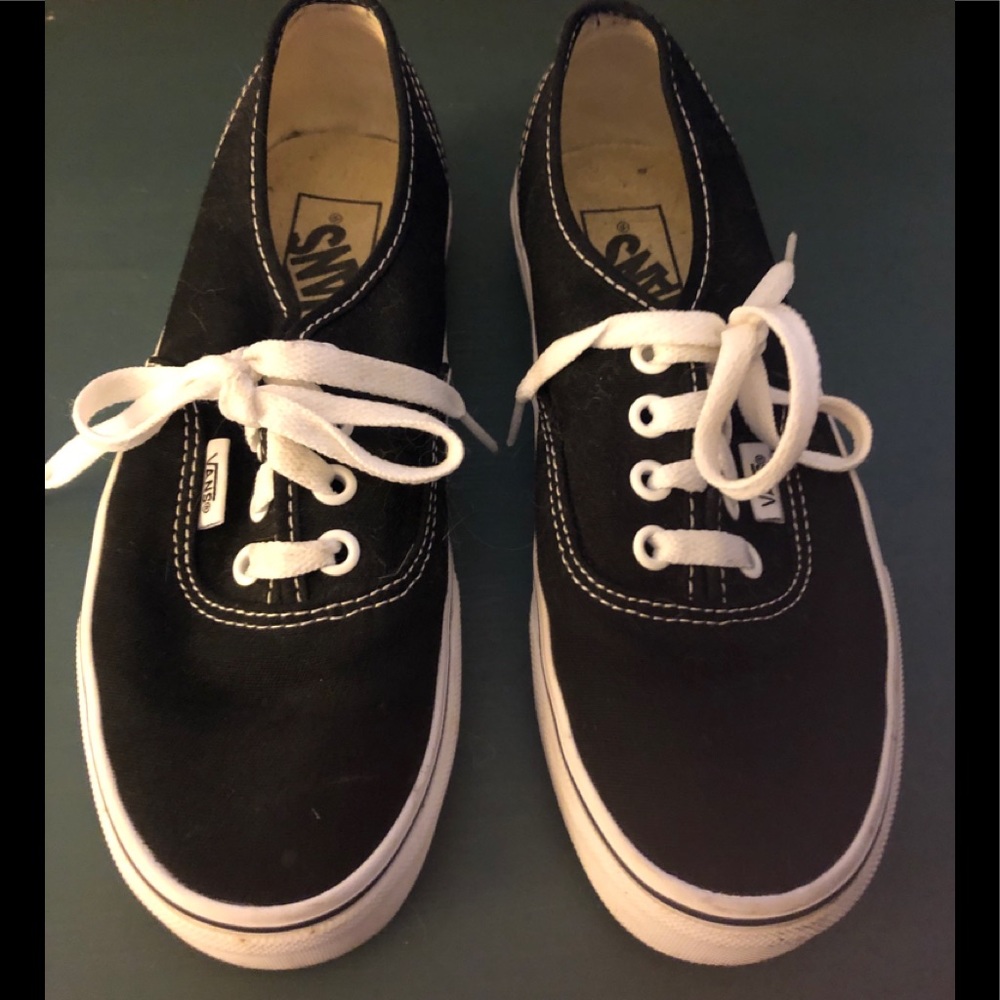 Black Vans with white sole